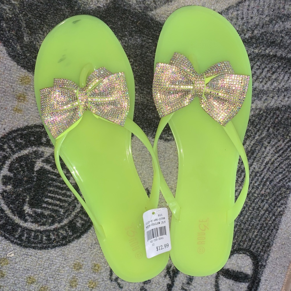 Neon yellow jelly jeweled flip flops